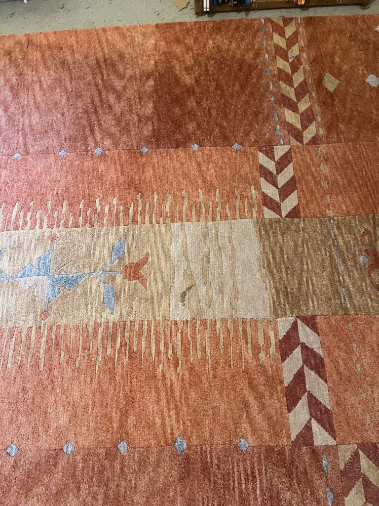 Lovely warm terracotta colours rug Large