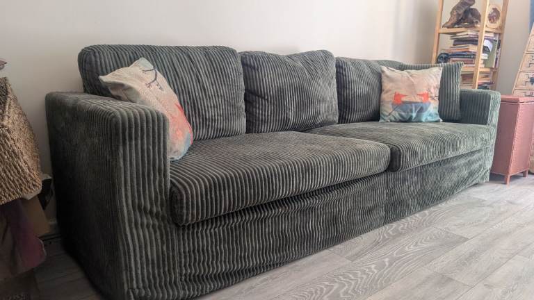 Corduroy green four seater sofa 