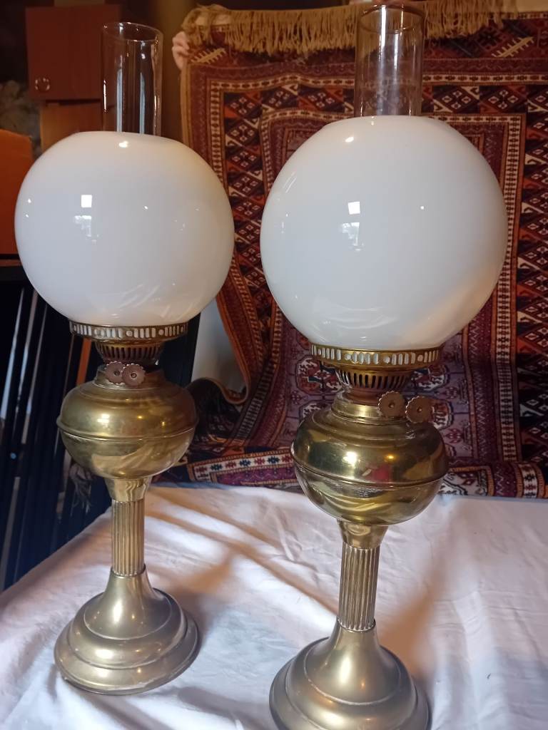 Pair of brass globe paraffin lamps