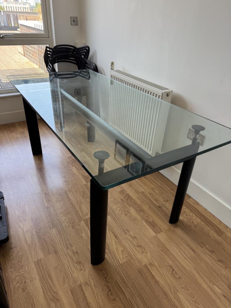 Glass Top Dining Table with Black Legs – Good Condition