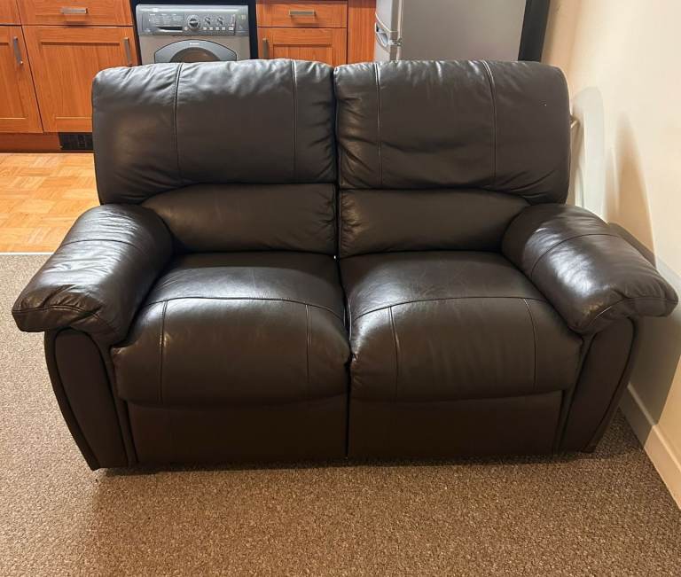 Dark brown 2 seater sofa recliner in good condition