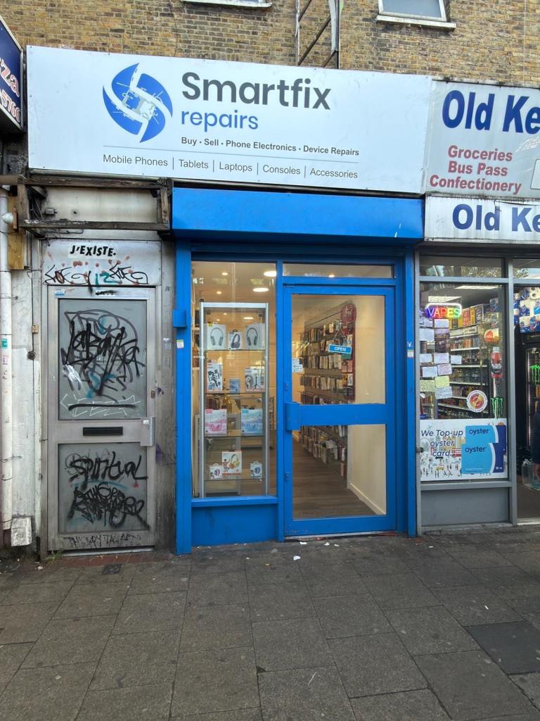 Mobile phone and accessories shop Main road busy high street in front bus stop 