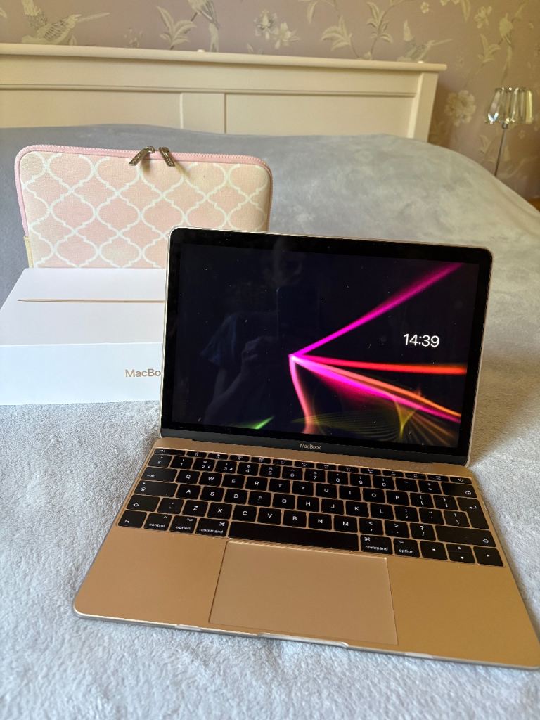 Gold MacBook (12-inch) with protective cover and carry case 