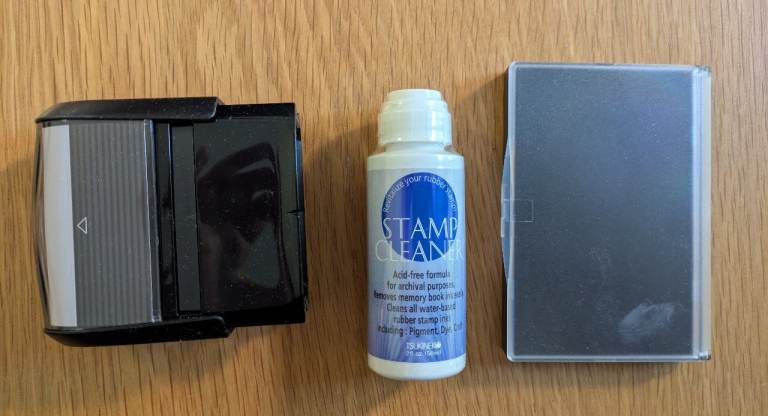 Retractable stamp (no design) with black inkpad and stamp cleaner