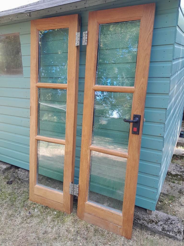 Solid oak French doors and frame.