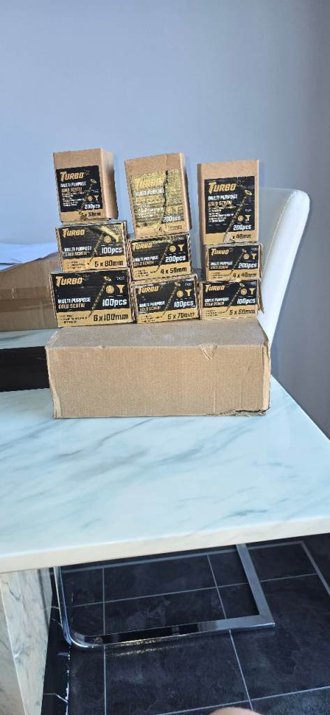 2 boxes of multi purpose gold screws