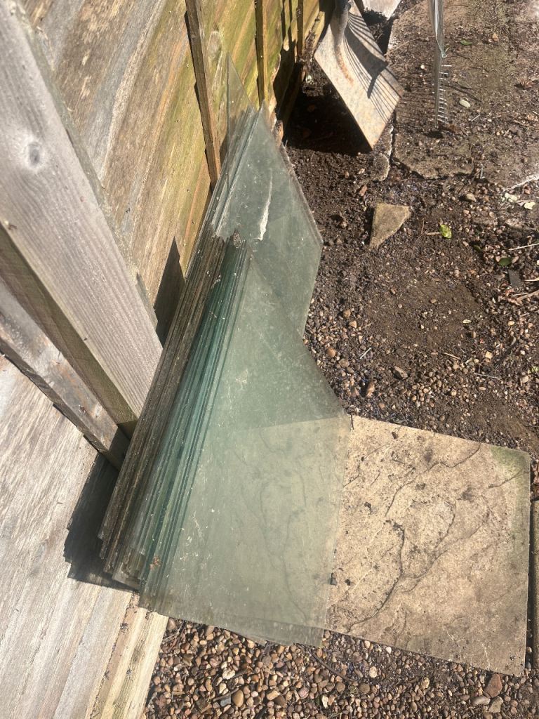 Approximately 30 sheets greenhouse glass only