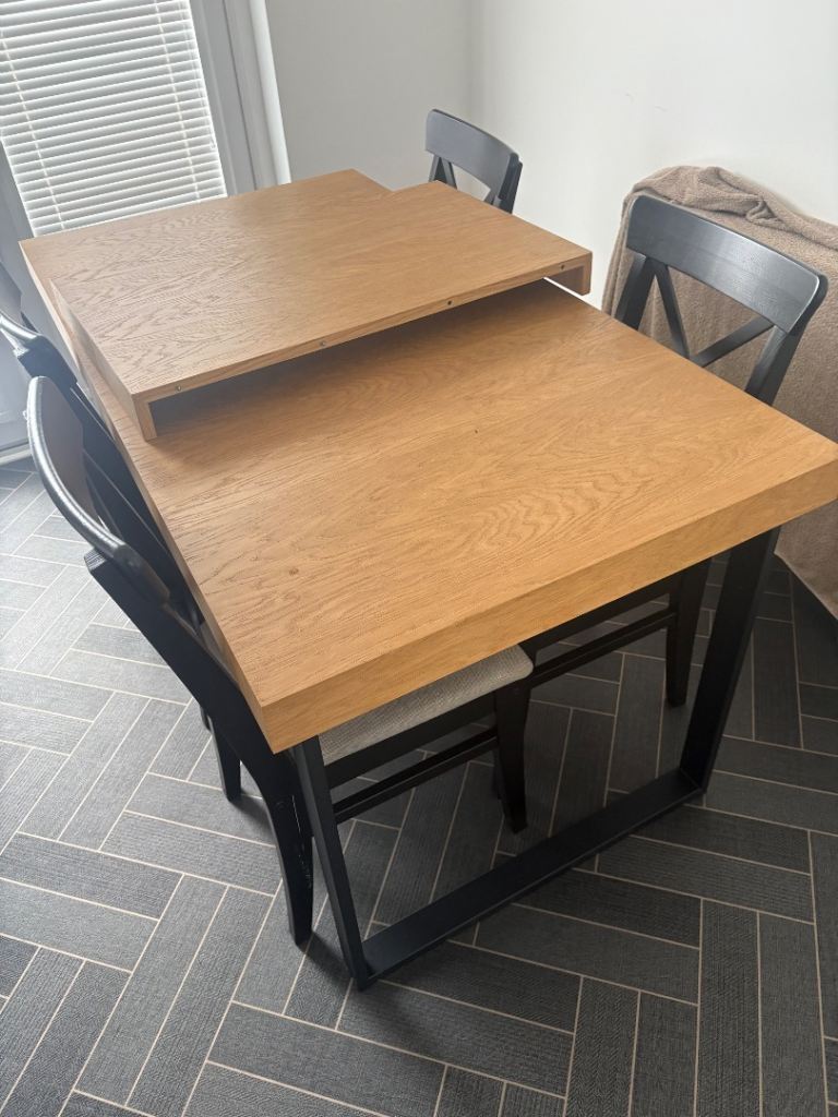 Extendable Wooden Dining Table with Black Chairs