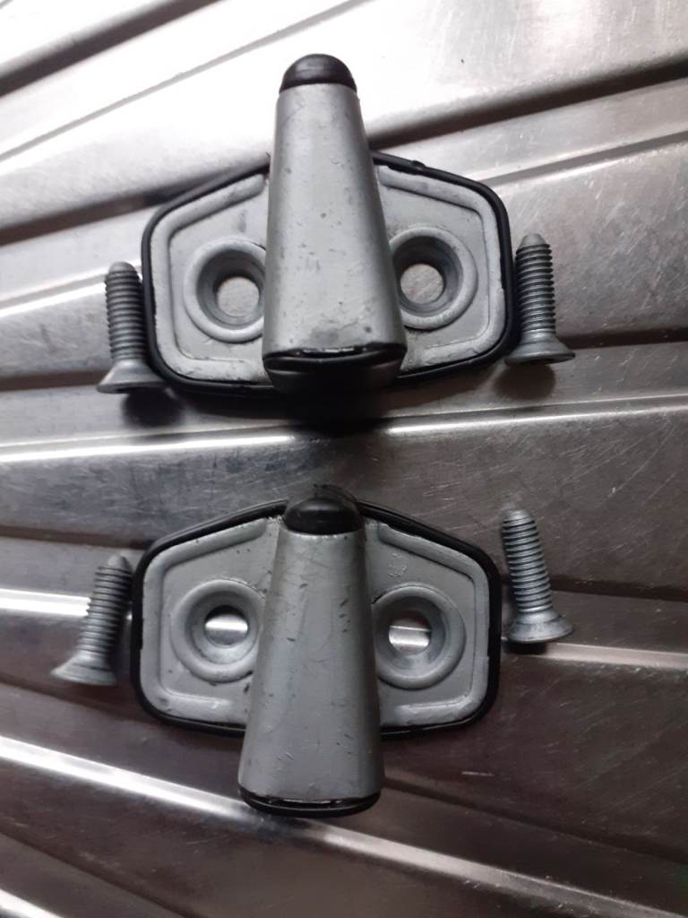 Left and right front door lock strikers