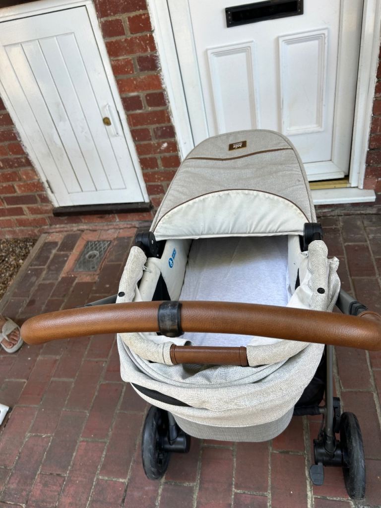 Baby stroller with height adjustable handle