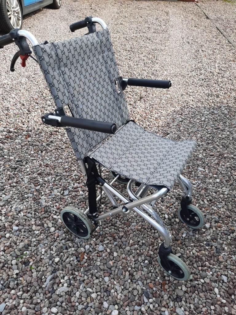 Compact lightweight folding wheelchair