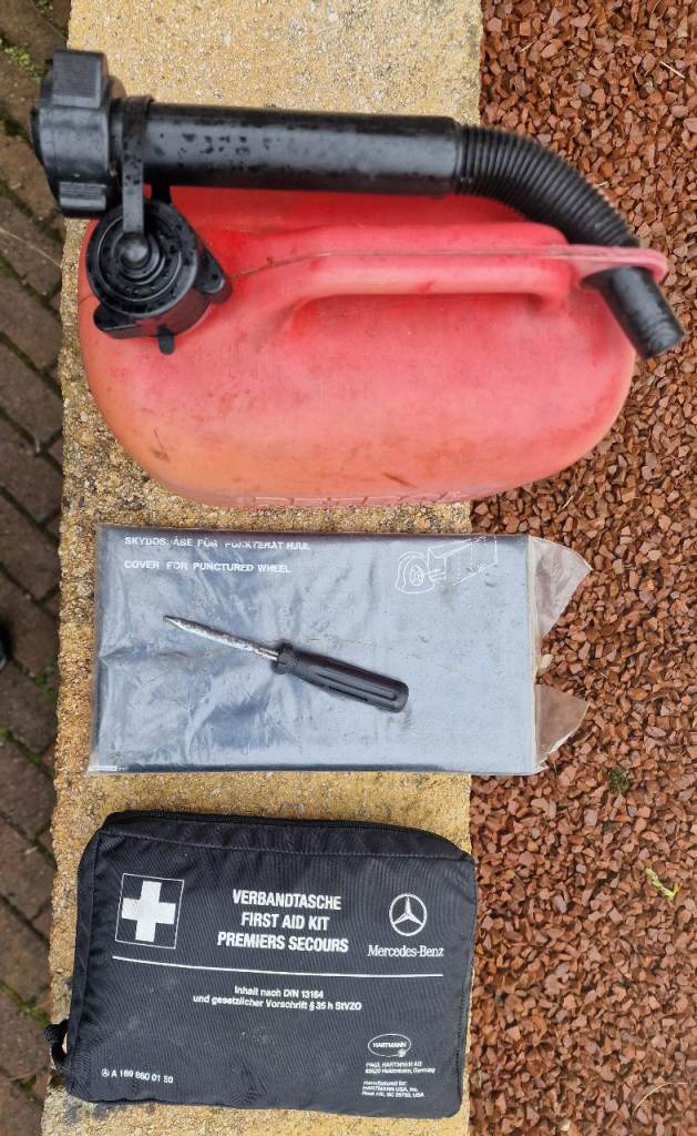 Mercedes first aid kit, wheel bag, petrol can and double ended screwdriver
