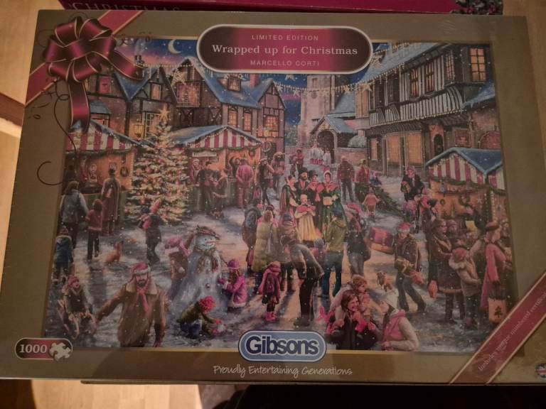 New sealed 1000 piece Gibsons Christmas jigsaw puzzle and two other opened Christmas puzzles