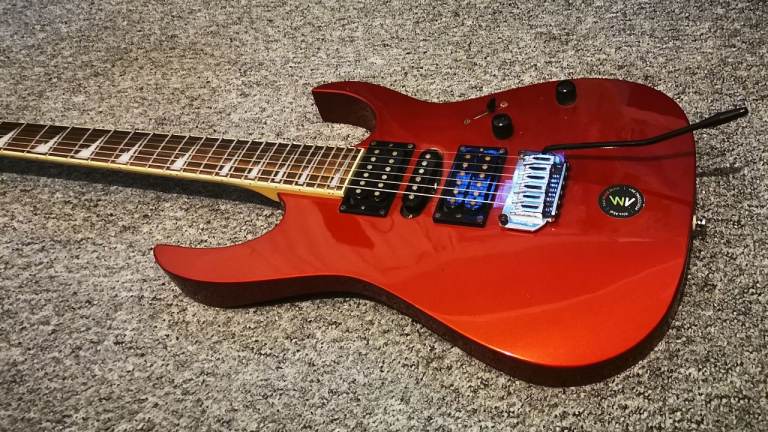 Red Ibanez Electric Guitar in good condition
