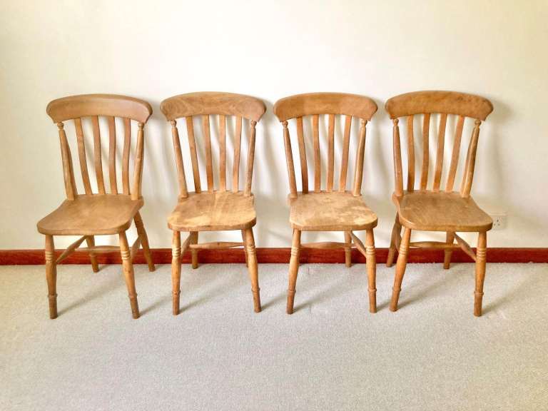 Four wooden kitchen chairs