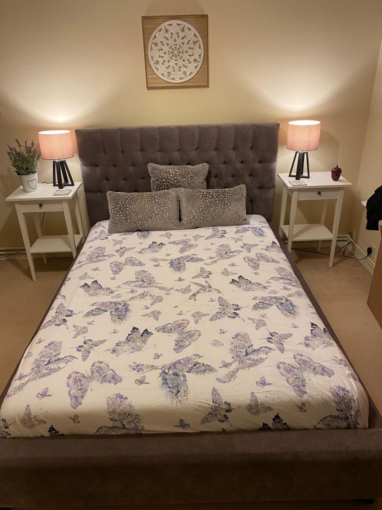 Purple velvet frame and headboard doble bed with wooden slats.  