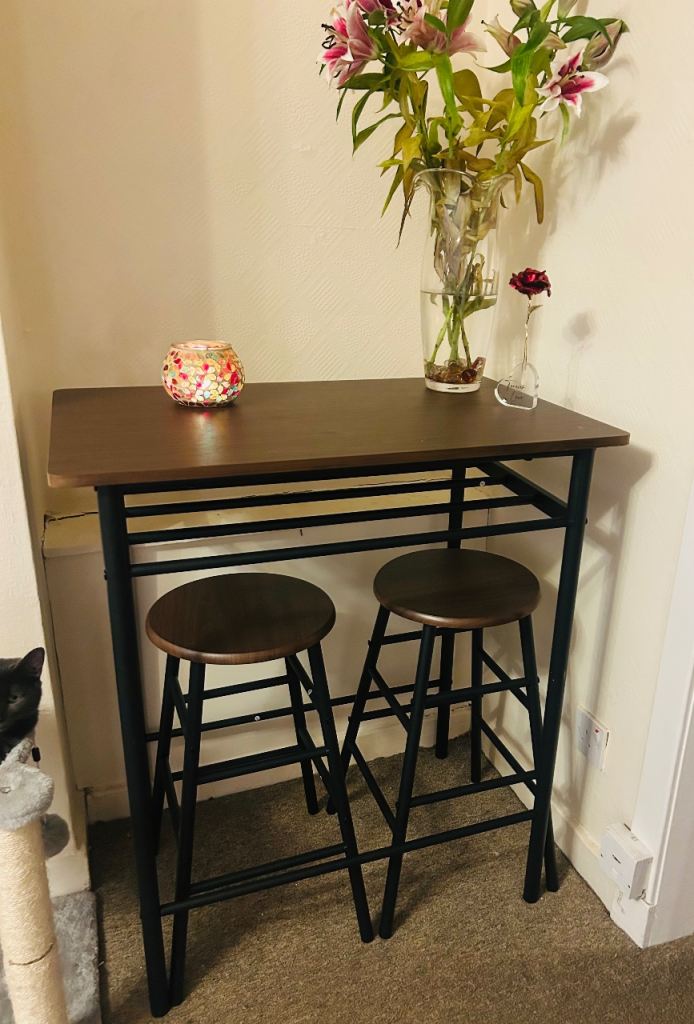 Brand new still in box bar table with 2 chairs for sale.
