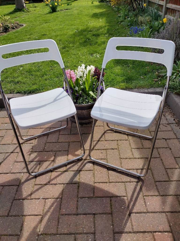 2 X NISSE WHITE ACYRLIC CHROME FOLDING CHAIRS.£30 EACH ( NEW £149)