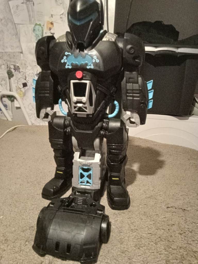 Giant robot makes sounds moving arms