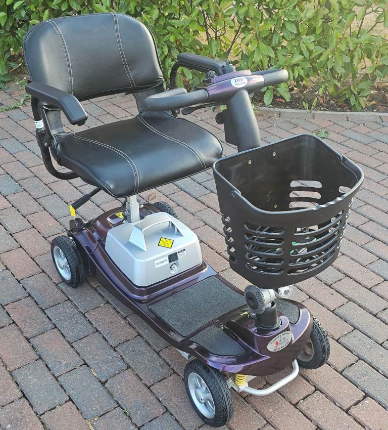 Light weight mobility scooter lithium battery comes apart to fit in car boot