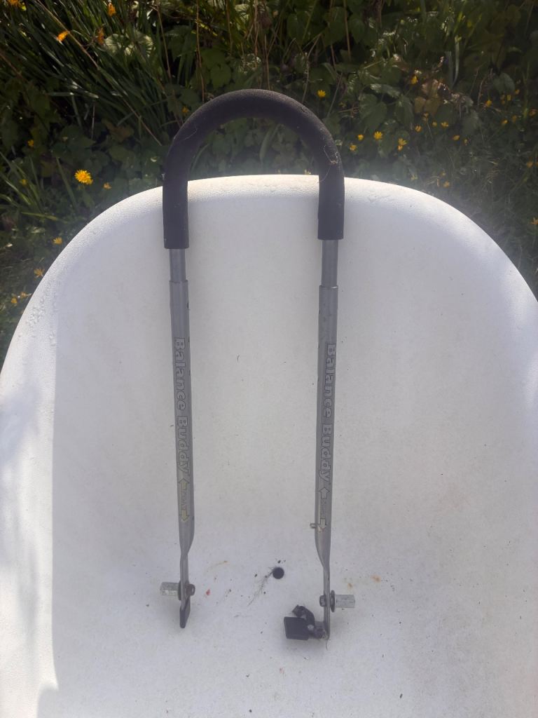 Bike balance buddy great aid to help a child learn to ride a bike without breaking your back