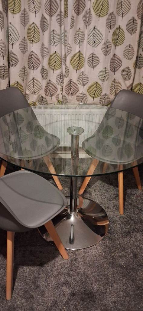 Round glass dining table with chairs 