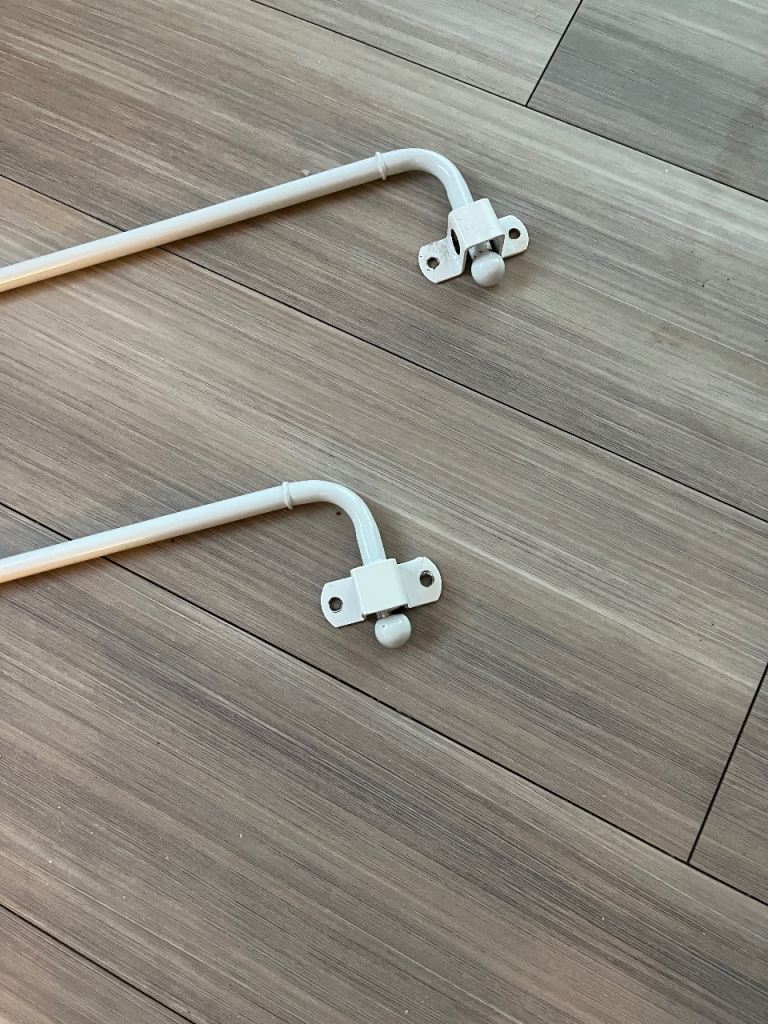 Swing arm curtain poles. 