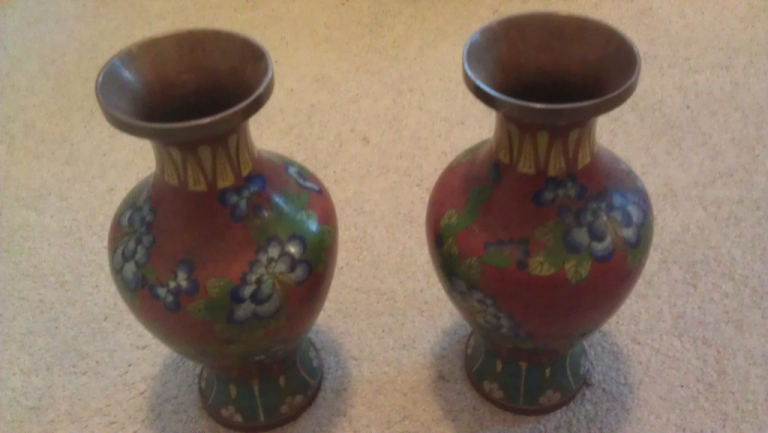copper vases with flower decorations