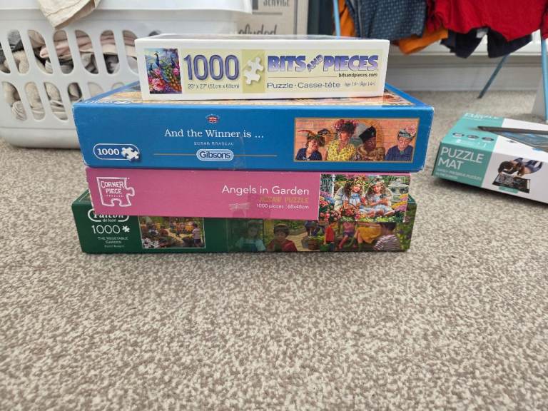 Four 1000-Piece Jigsaw Puzzles with Puzzle Mat – Good Condition