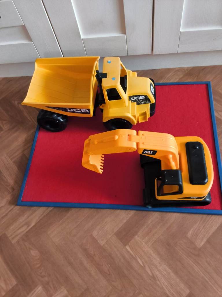 Childs  large jcb tip up lorry and a CAT digger loader. 