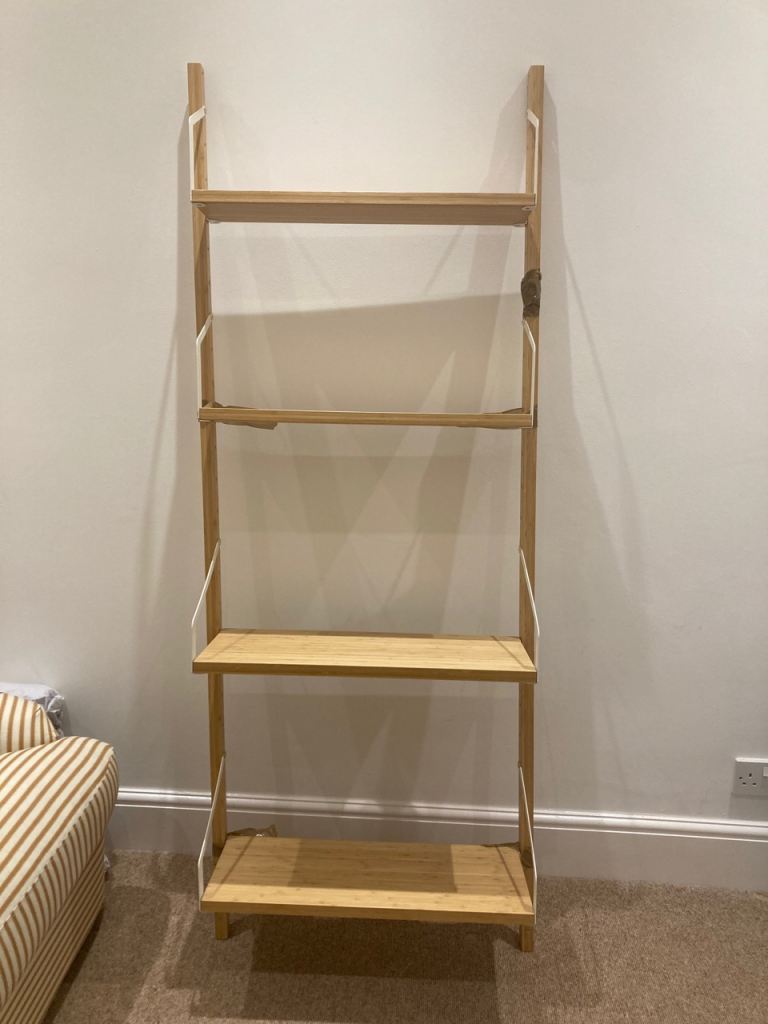 Ikea shelf with all screws taped on side (very light and slim)