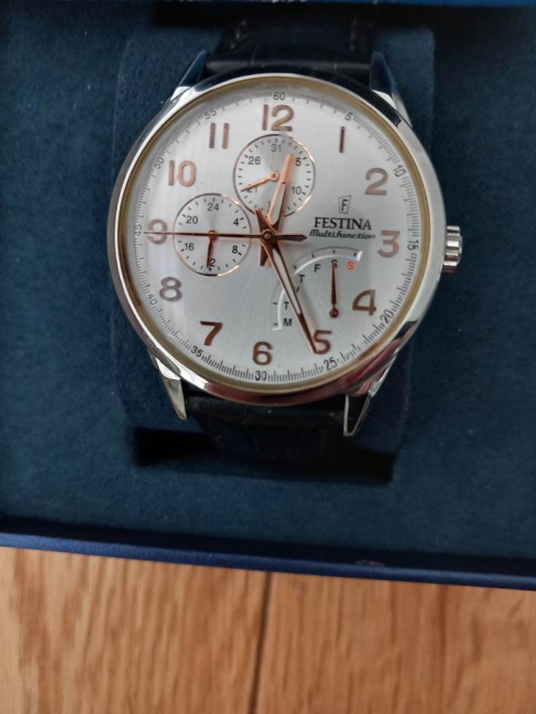 Festina quartz day/steel case gold numerals £65.