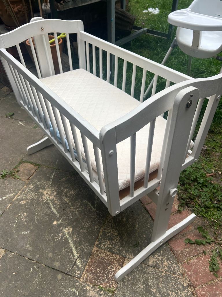 Swinging cot and high chair 