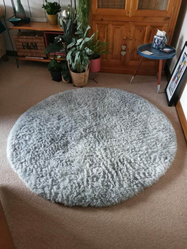 New - Round grey fluffy rug indoors