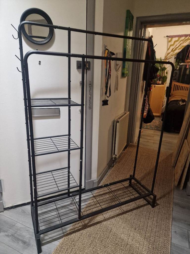 Double clothes rail with shelves 