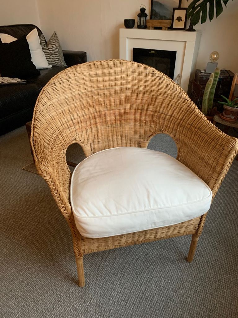 Large rattan chair with white cushion 