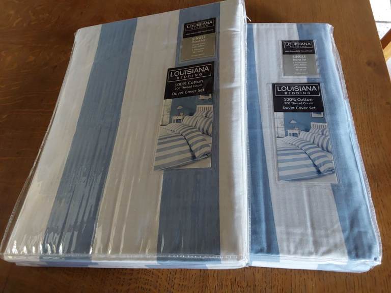 Two single duvet covers with matching pillowcases