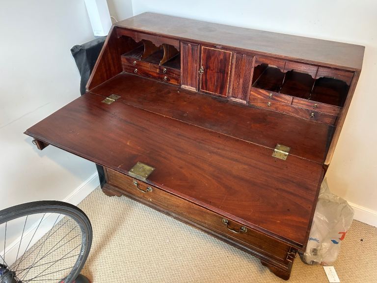 Antique desk, likely a 18th-century Chippendale-style slant-front bureau