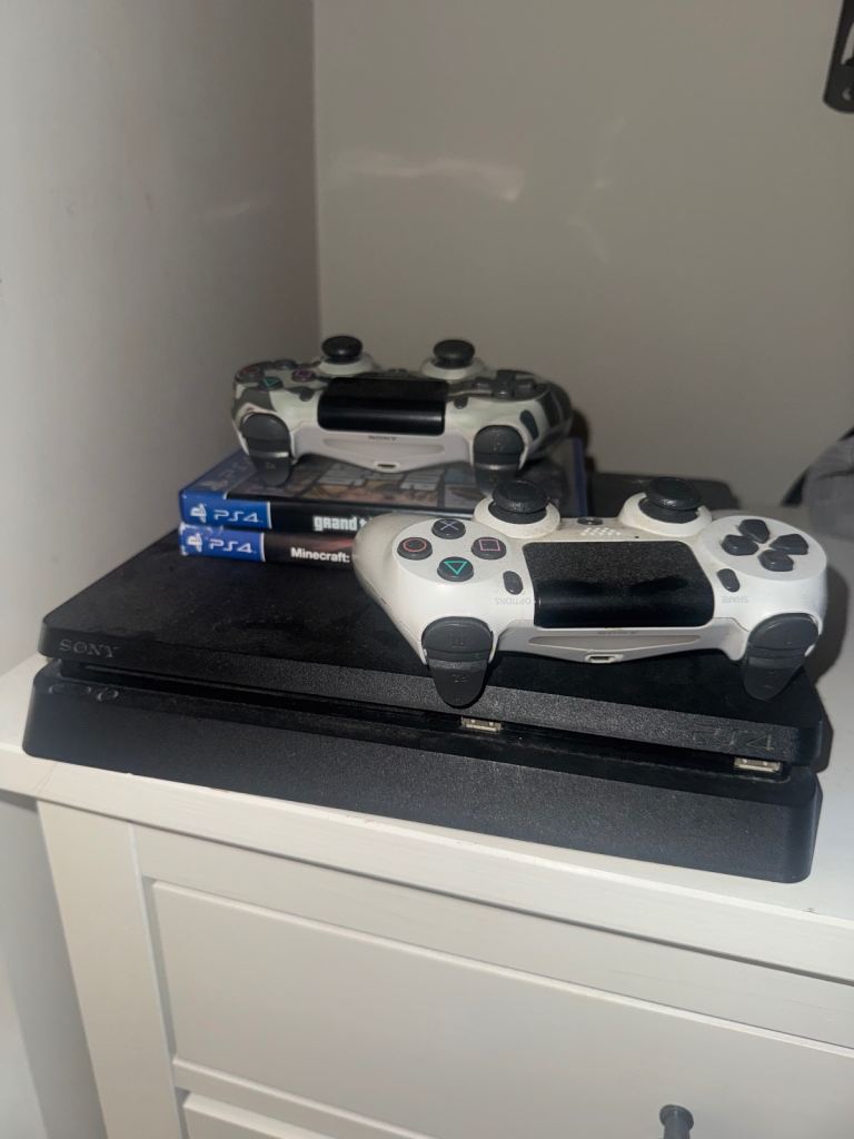 PS4 pro slim with 2 pads and games