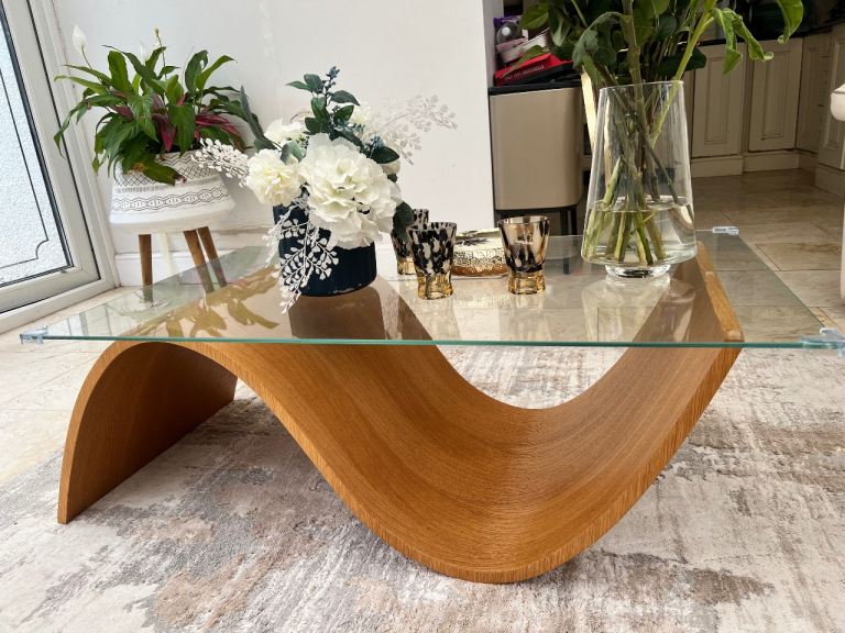 Tom Schneider Glass Top Rect Coffee Table with Curved Oak colour Wood Base 