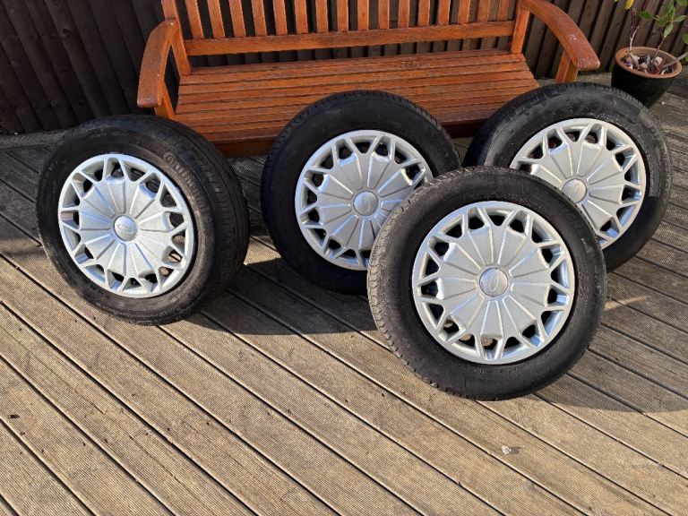 Four steel wheels with wheel trims