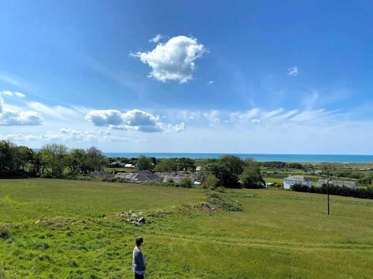 Land in Snowdonia Eryri Wales, with sea and mountain views. 