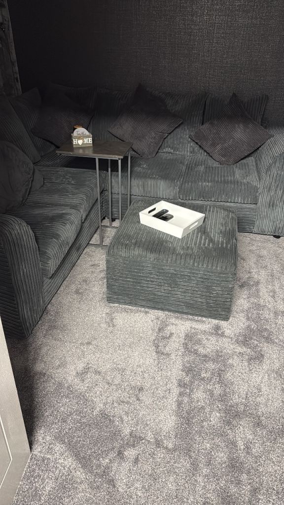 Grey corner sofa and pouffe