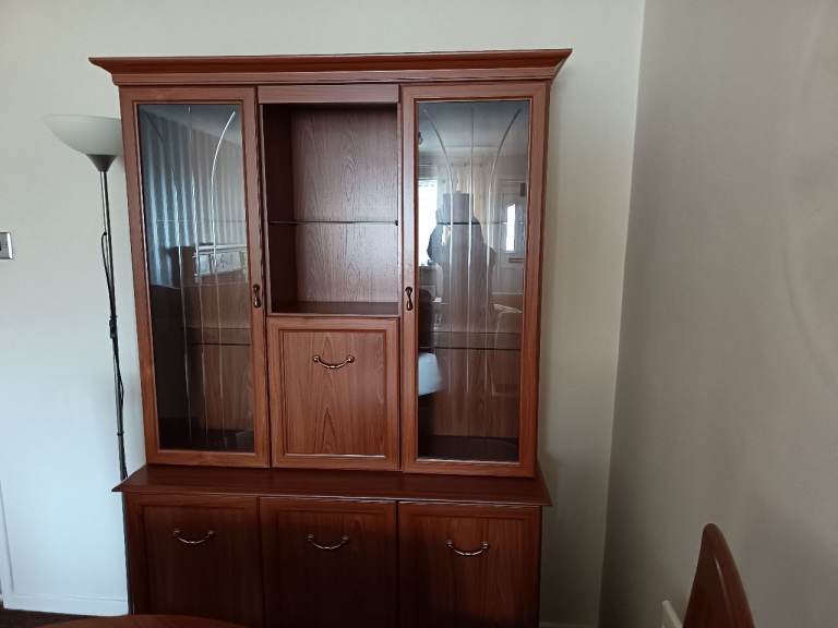 Mahogany display cabinet with lights in cabinet 