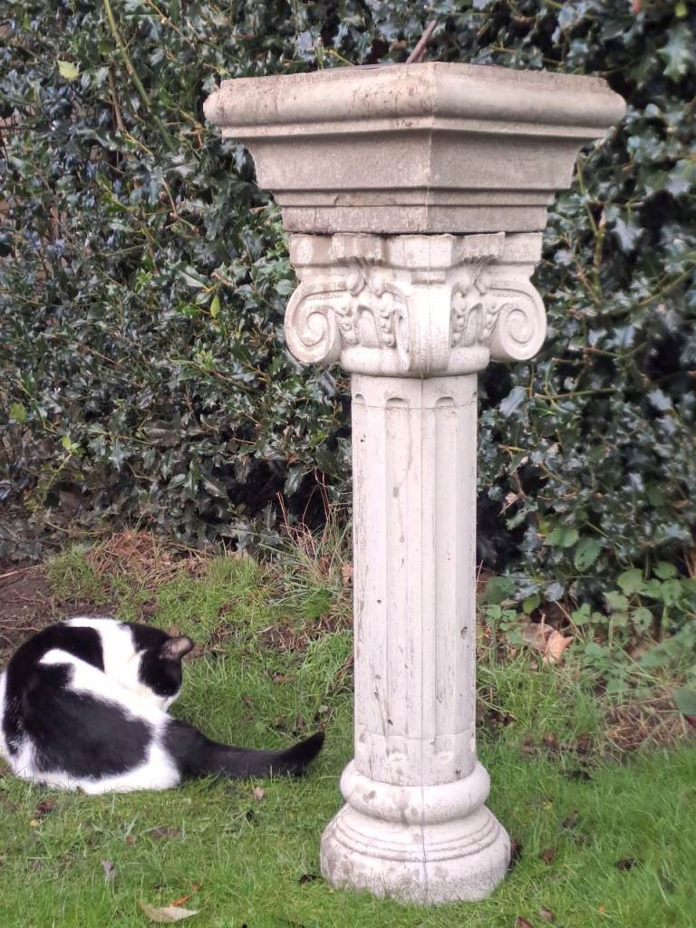 large stone and cast iron garden sundial