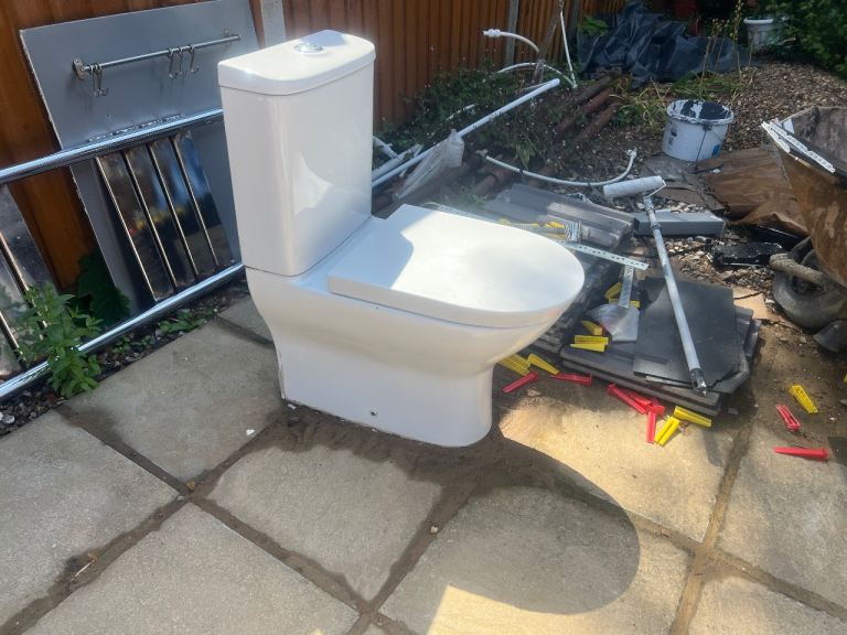 White ceramic soft closing toilet