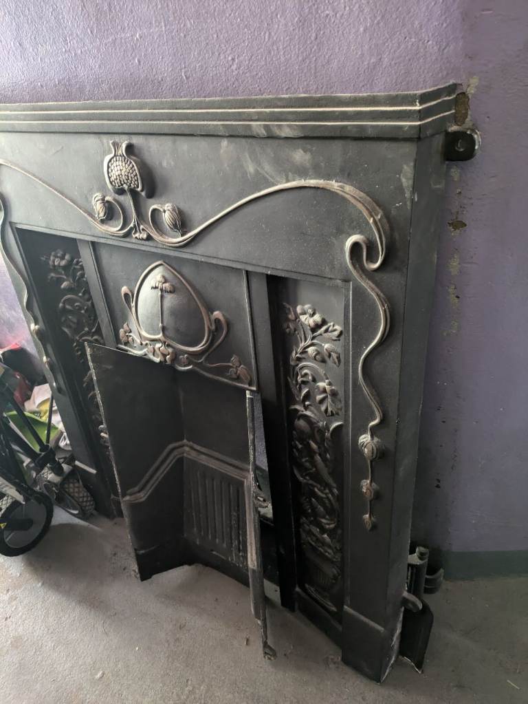 Vintage cast iron fireplace surround including mantel