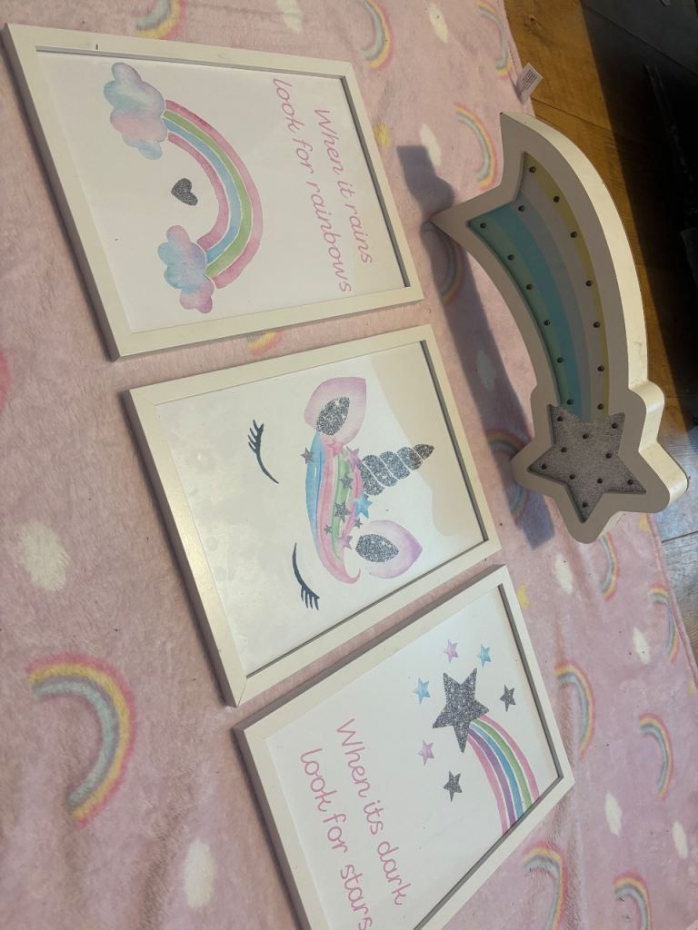 Lovely set of three framed pictures featuring a unicorn and rainbows
