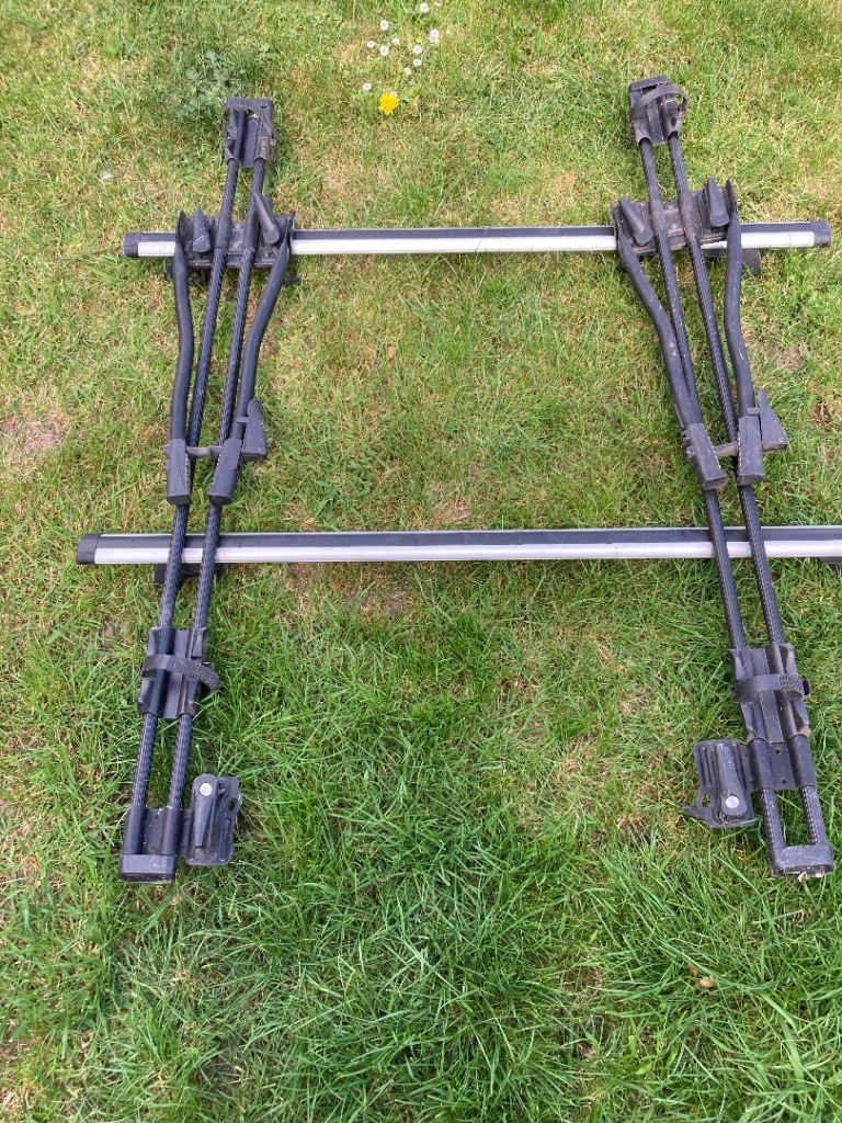 Car roof bars and 2 Thule bike racks