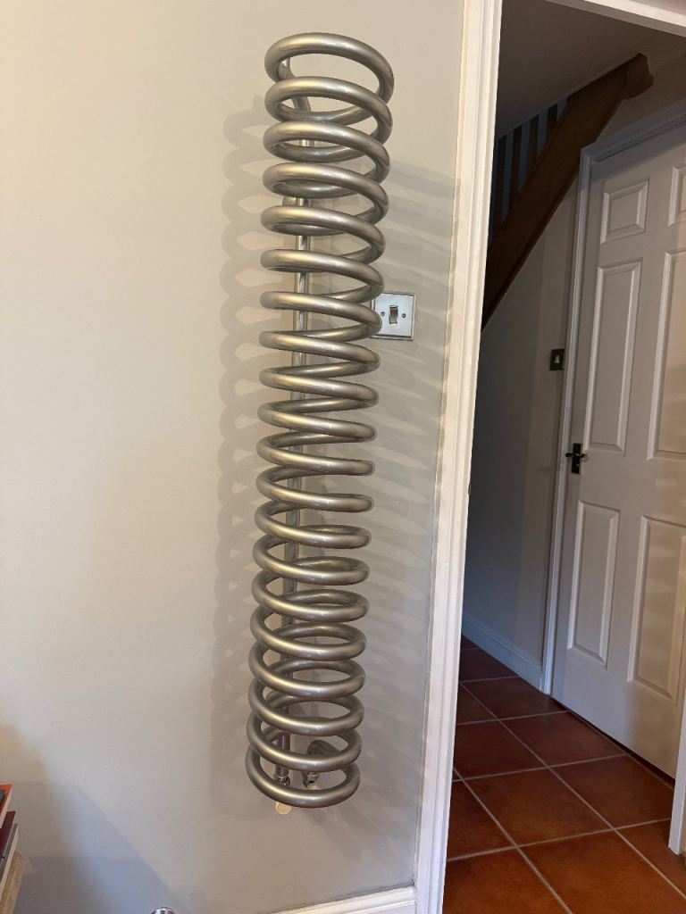 Designer Radiator Swiss Bisque Spiral Radiator. Very good condition, silver in colour.